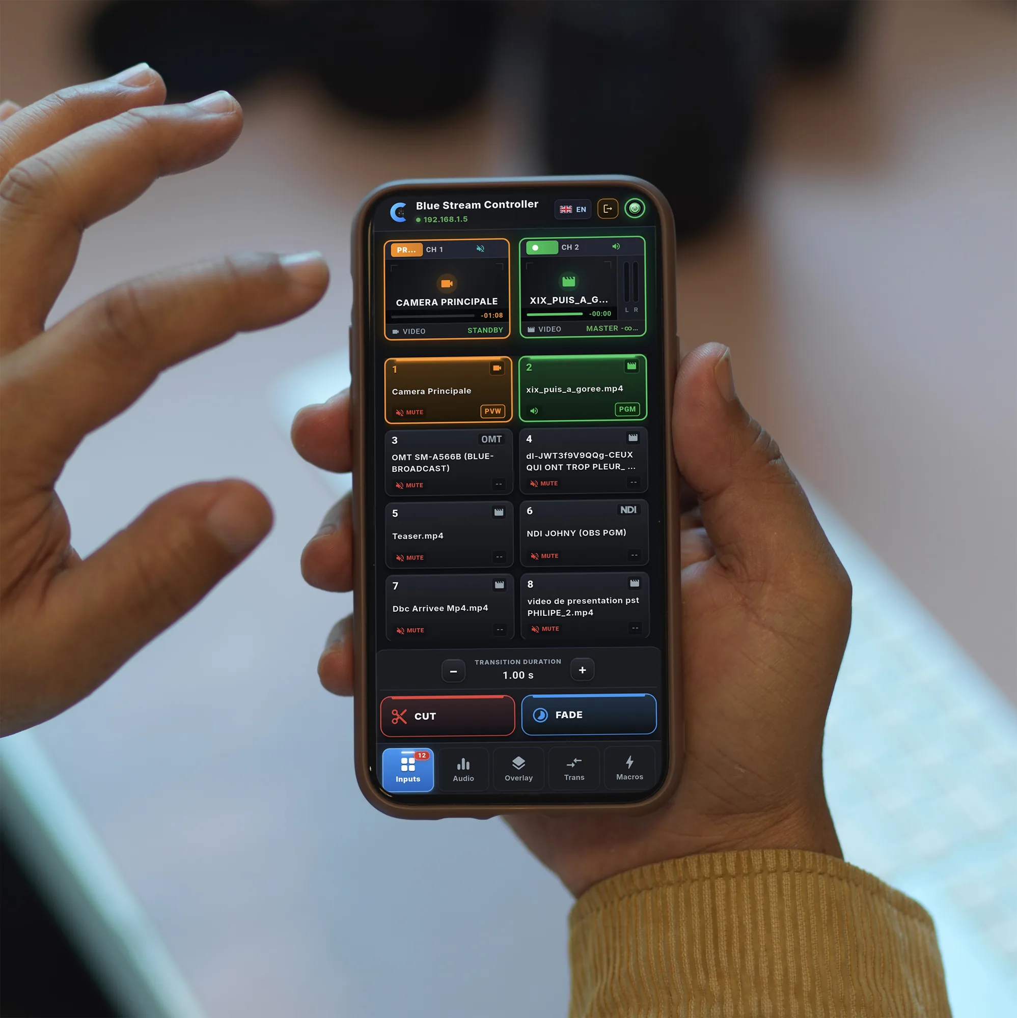 An operator picks a vMix input in Blue Stream Controller on their phone
